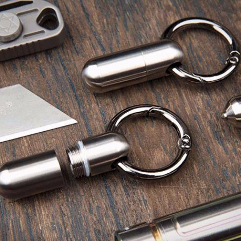 Преносима бутилка с мини уплътнения Водоустойчива кутия Бутилки за лекарства Титаниева сплав Калъф за хапчета за първа помощ EDC Консумативи Ключодържател