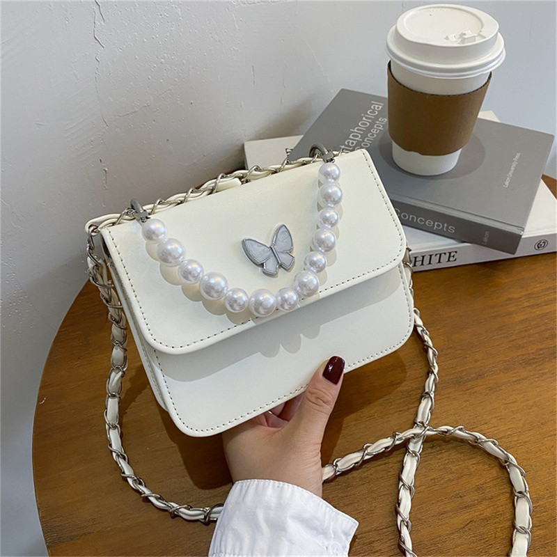 Klassikalised ühevärvilised PU õlakotid Naistele Pearl Butterfly käekotid Kandid naistele vabaaja reisimiseks Crossbody slingi kott