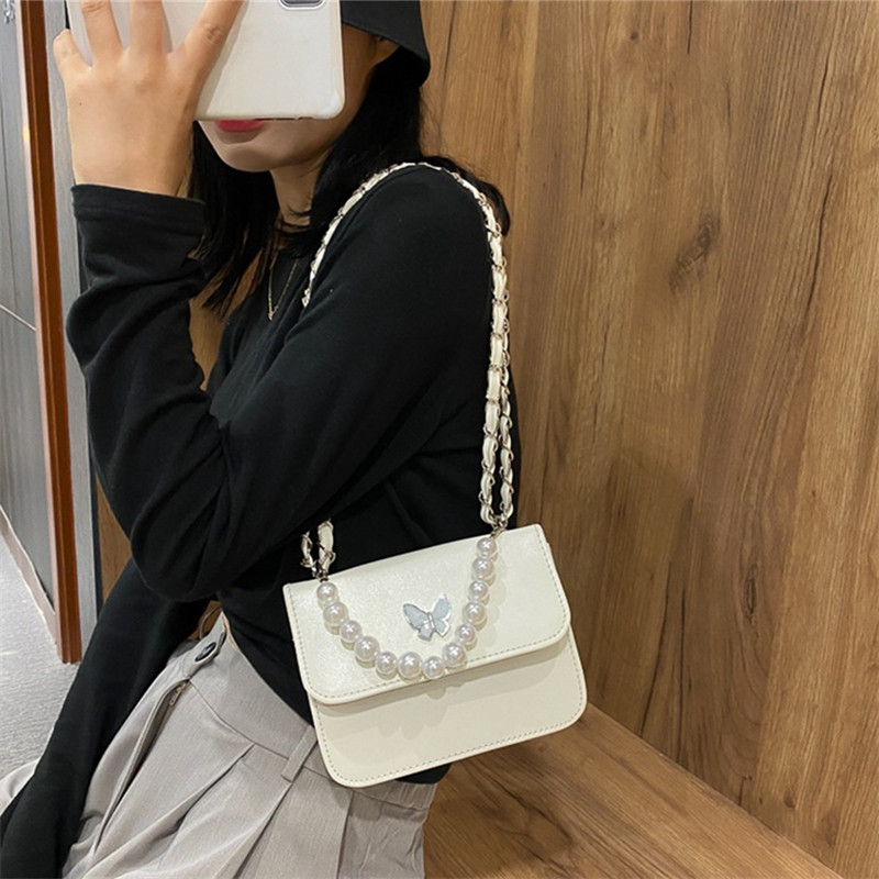 Klassikalised ühevärvilised PU õlakotid Naistele Pearl Butterfly käekotid Kandid naistele vabaaja reisimiseks Crossbody slingi kott