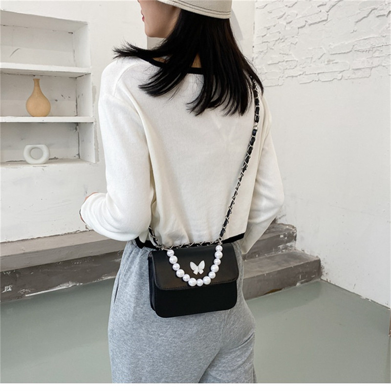 Klassikalised ühevärvilised PU õlakotid Naistele Pearl Butterfly käekotid Kandid naistele vabaaja reisimiseks Crossbody slingi kott