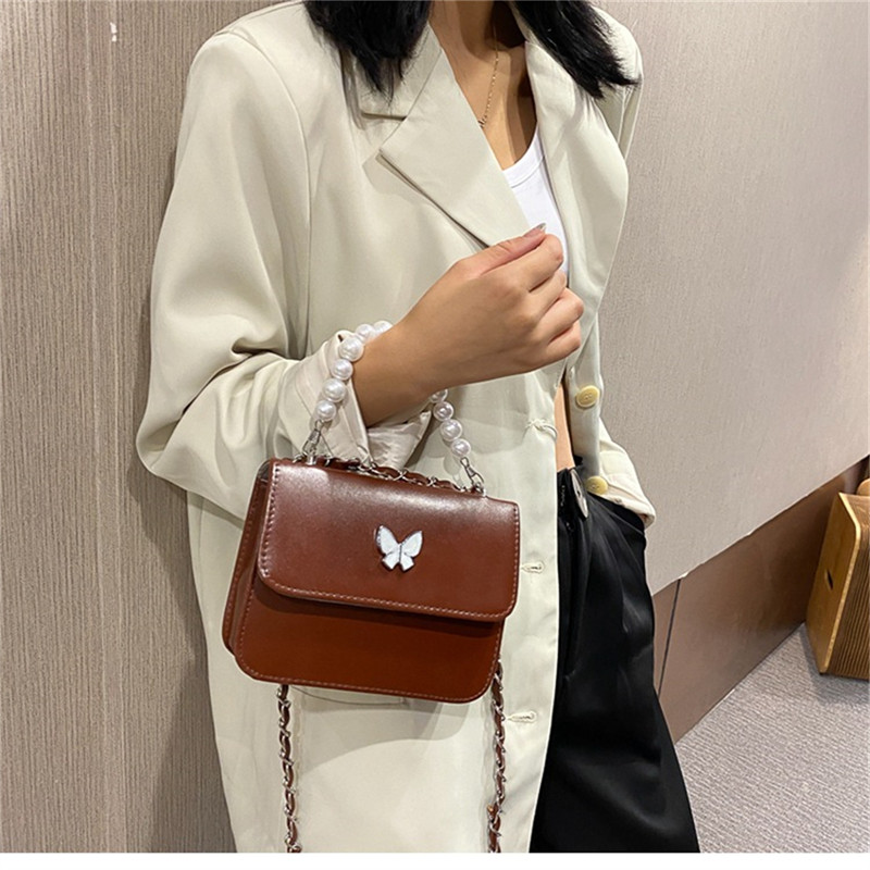 Klassikalised ühevärvilised PU õlakotid Naistele Pearl Butterfly käekotid Kandid naistele vabaaja reisimiseks Crossbody slingi kott