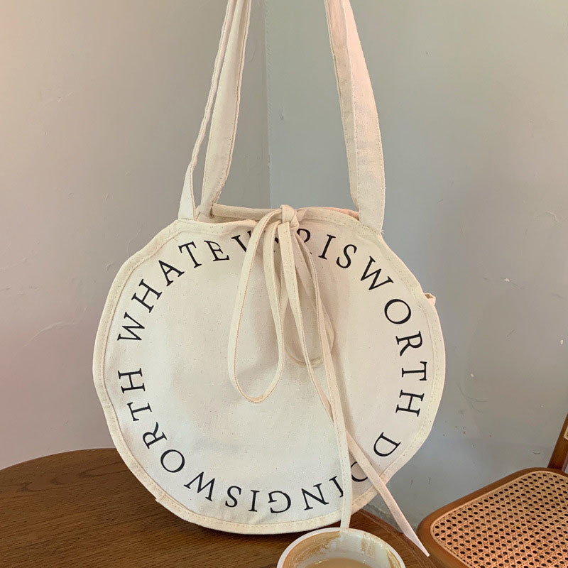 Hylhexyr naiste ümmargune õlakott Kirjaga lõuendikotid Lihtne, suure mahutavusega kaasaskantav vabaaja käekott.