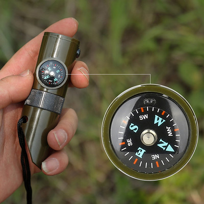 New 7 in1 Emergency Survival Whistle Compass Multifunction Tool Magnifier Flashlight Storage Container Thermometer