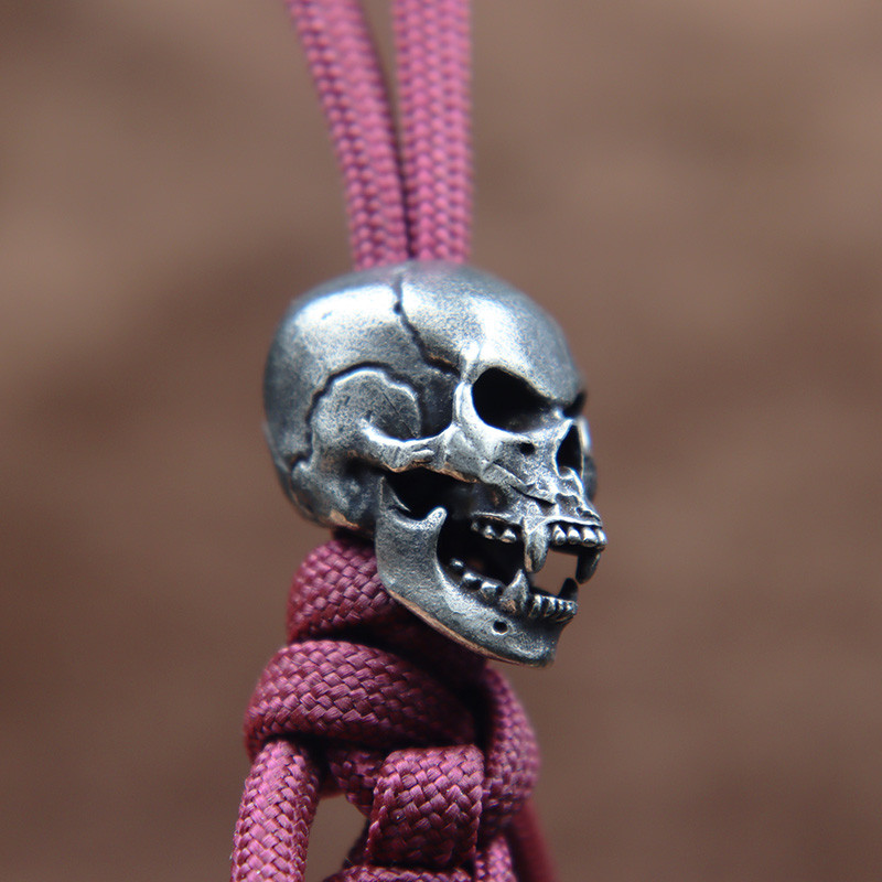 Karmid hambad Koljupea Messingist Paracord Helmed Paelad Ripatsid DIY EDC Välistööriist Vihmavarjunöör kootud nugade amuletid Aksessuaarid