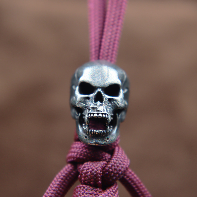 Karmid hambad Koljupea Messingist Paracord Helmed Paelad Ripatsid DIY EDC Välistööriist Vihmavarjunöör kootud nugade amuletid Aksessuaarid