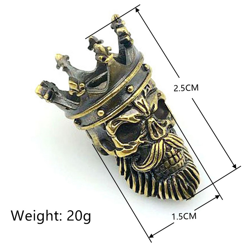 Misiņa kronis, galvaskauss, nazis, krelles, dažādi instrumenti, austi paracord ārā