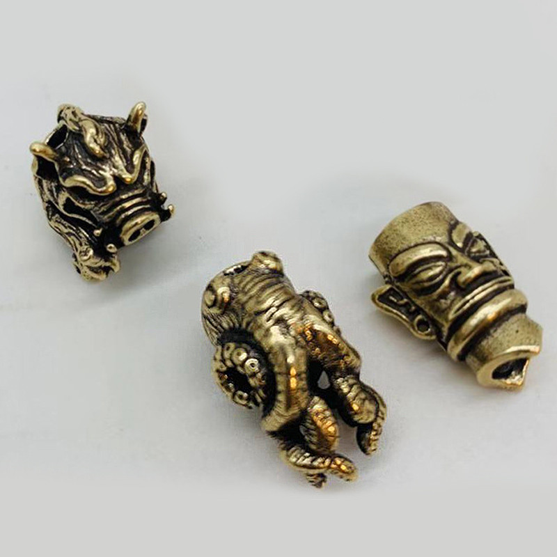 1tk/partii Kaheksajalg Noahelmed Messingist Metssea Helmed Vihmavarju Köis Ripats Punane Vask Paracord Helmed DIY