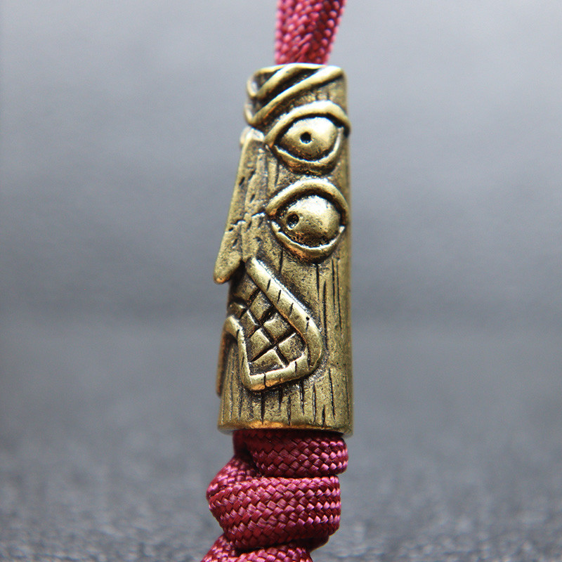 Statuie de desen animat totem de pasăre cu patru ochi din alamă de epocă