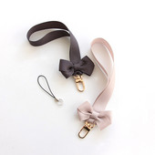 Bowknot mobiltelefon lánc medál univerzális kézszíj ajándék gyermekbarátoknak USB jelvény kulcstartó csuklópánt