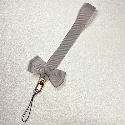 Bowknot mobiltelefon lánc medál univerzális kézszíj ajándék gyermekbarátoknak USB jelvény kulcstartó csuklópánt