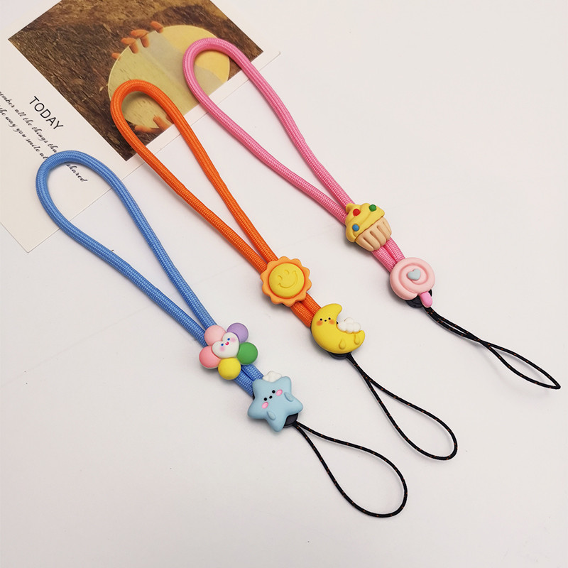 Κοντό μενταγιόν καρπού κινούμενα σχέδια Χαριτωμένο υφαντό κρεμαστό μενταγιόν καρπού κορδόνι τηλεφώνου κατά της απώλειας Ρυθμιζόμενο αποσπώμενο λουρί Κορδόνι κινητού τηλεφώνου