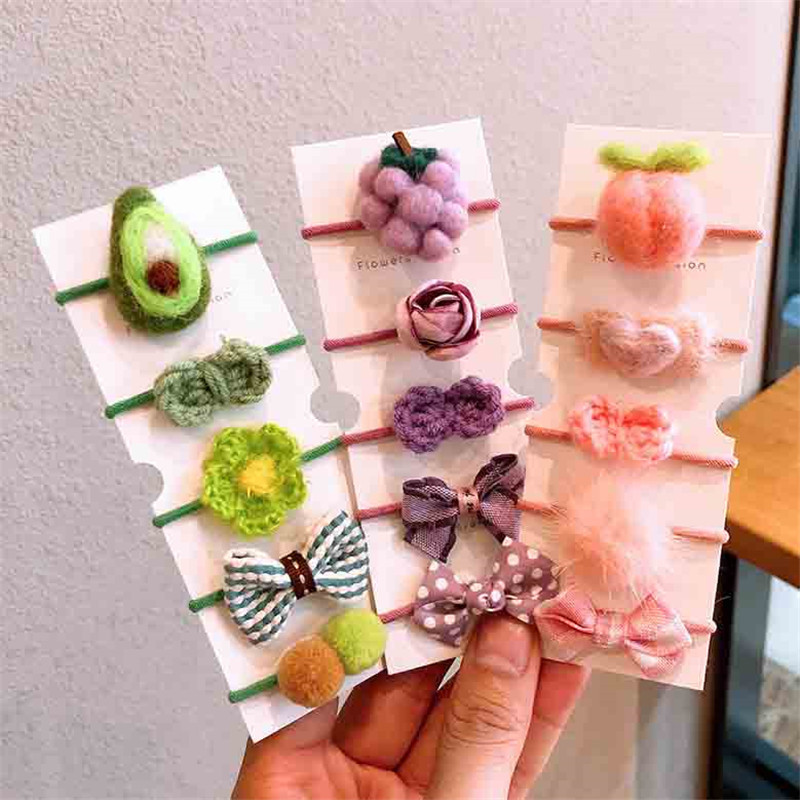 Őszi és téli új gyapjú filc öltöny Gyerek fejfedő Rajzfilm táska kis gumiszalag masni csomó haj kötél