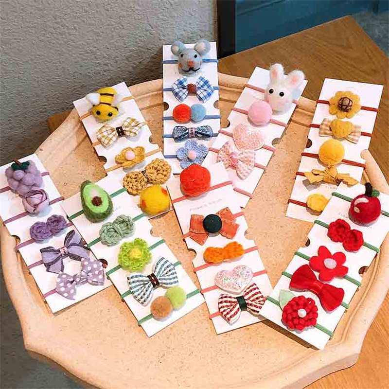 Őszi és téli új gyapjú filc öltöny Gyerek fejfedő Rajzfilm táska kis gumiszalag masni csomó haj kötél