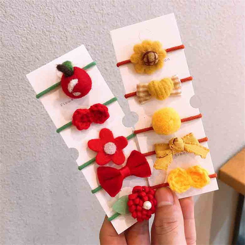 Őszi és téli új gyapjú filc öltöny Gyerek fejfedő Rajzfilm táska kis gumiszalag masni csomó haj kötél