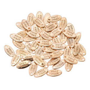 50 tk Käsitööna valmistatud käsitöörõivaste kaunistus metallist siltide jaoks DIY õmblemine naiste kotid Sildid Aksessuaarid Tarvikud