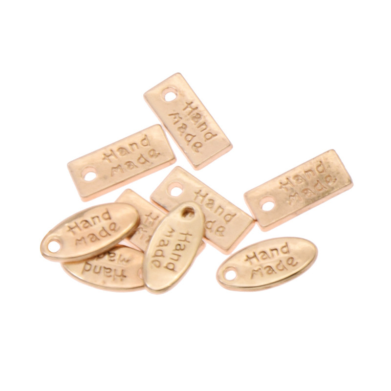 50 tk Käsitööna valmistatud käsitöörõivaste kaunistus metallist siltide jaoks DIY õmblemine naiste kotid Sildid Aksessuaarid Tarvikud