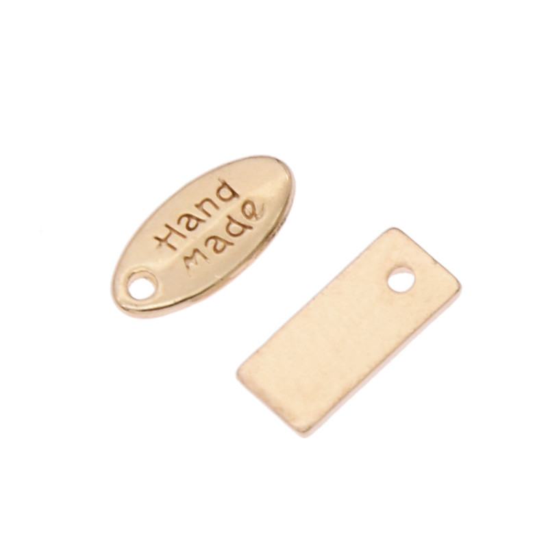 50 tk Käsitööna valmistatud käsitöörõivaste kaunistus metallist siltide jaoks DIY õmblemine naiste kotid Sildid Aksessuaarid Tarvikud