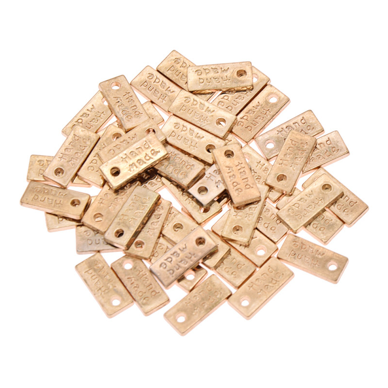 50 tk Käsitööna valmistatud käsitöörõivaste kaunistus metallist siltide jaoks DIY õmblemine naiste kotid Sildid Aksessuaarid Tarvikud