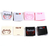 100 komada Ručno izrađeno s ljubavnim oznakama Pravokutni uzorak krila Poliesterske sklopive platnene naljepnice za pletene šešire Tkana oznaka za šivanje odjeće