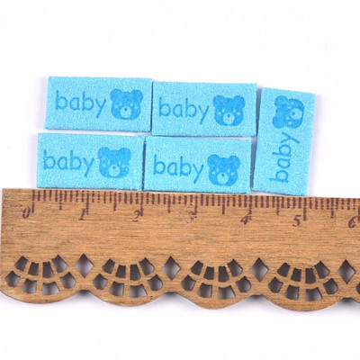 50 db Többszínű dombornyomott bőr baba mackó címkék barkács kézműves ruha kellékek varrás kiegészítők ruha sapkák cipő címkék
