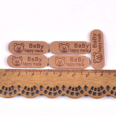 50 db Ruha baba medve mintás címkék dombornyomott címkék barkácsolás zászlós címke ruhavarró kiegészítőkhöz30x10mm cp3509