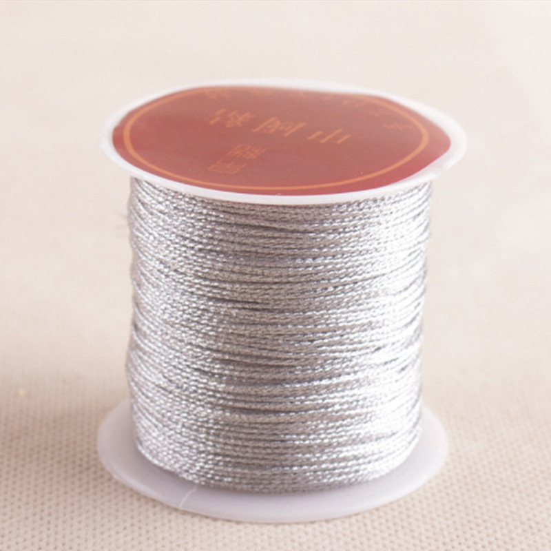 Zlatno srebrna boja 100m/rola Izdržljivi overlock konci za šivaće strojeve Poliesterski križni bod Čvrsti konci za pribor za šivanje