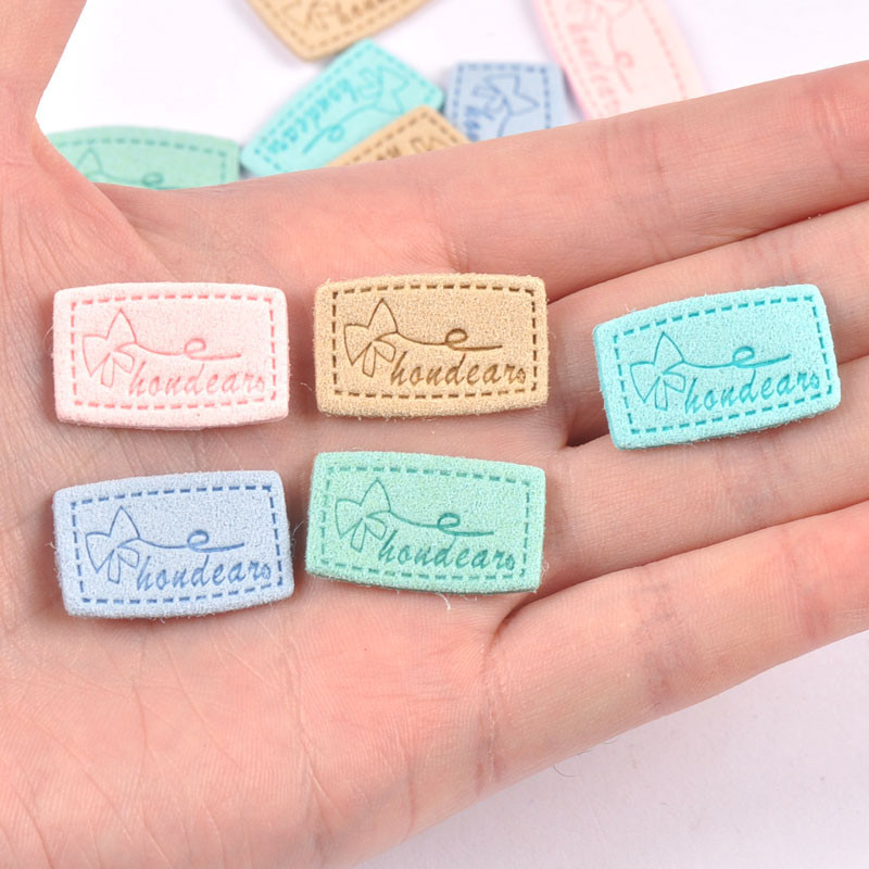 20 kom Mix Color Mašne Reljefne Flanelette Etikete DIY Rukotvorine Rukotvorine Dodaci za šivanje za odjeću Oznake za odjeću c3212