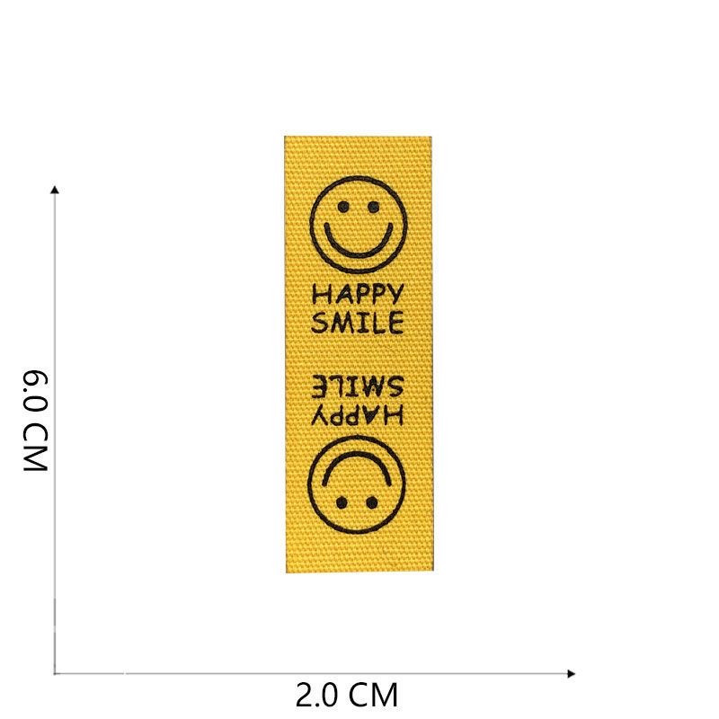 Naljepnice od tkanine Ručno izrađene naljepnice Preklopne oznake Uzorak osmijeha Ručno izrađene naljepnice za pletene kape Otisnute pamučno tkane šivane oznake 22120101