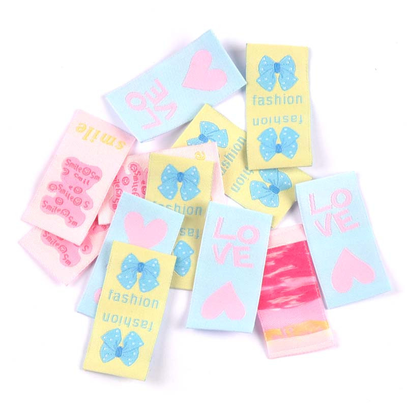 Ručne tkané štítky so zmiešaným kresleným vzorom mašlí, 50 ks, na oblečenie, topánky, tašky, visačky na odev, 42x25 mm, CP3272