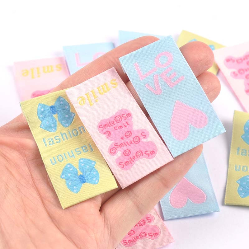 Ručne tkané štítky so zmiešaným kresleným vzorom mašlí, 50 ks, na oblečenie, topánky, tašky, visačky na odev, 42x25 mm, CP3272