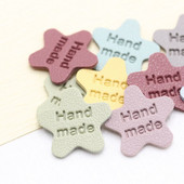 Ručne vyrobené štítky v tvare hviezdy na pletené čiapky, potlačené bavlnené tkané visačky na šitie 22112401