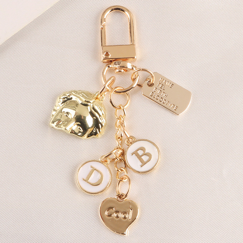 2 db táska medál Kreatív aranyos gyöngy félarcú ötvözet kulcstartó Divat autós kulcstartó kulcstartó medál táska bűbáj ékszer kiegészítők