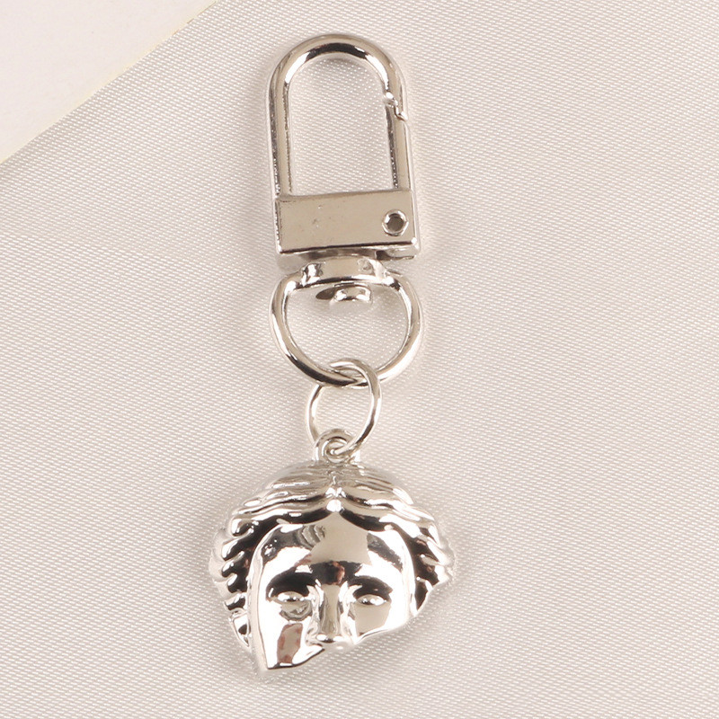 2 db táska medál Kreatív aranyos gyöngy félarcú ötvözet kulcstartó Divat autós kulcstartó kulcstartó medál táska bűbáj ékszer kiegészítők