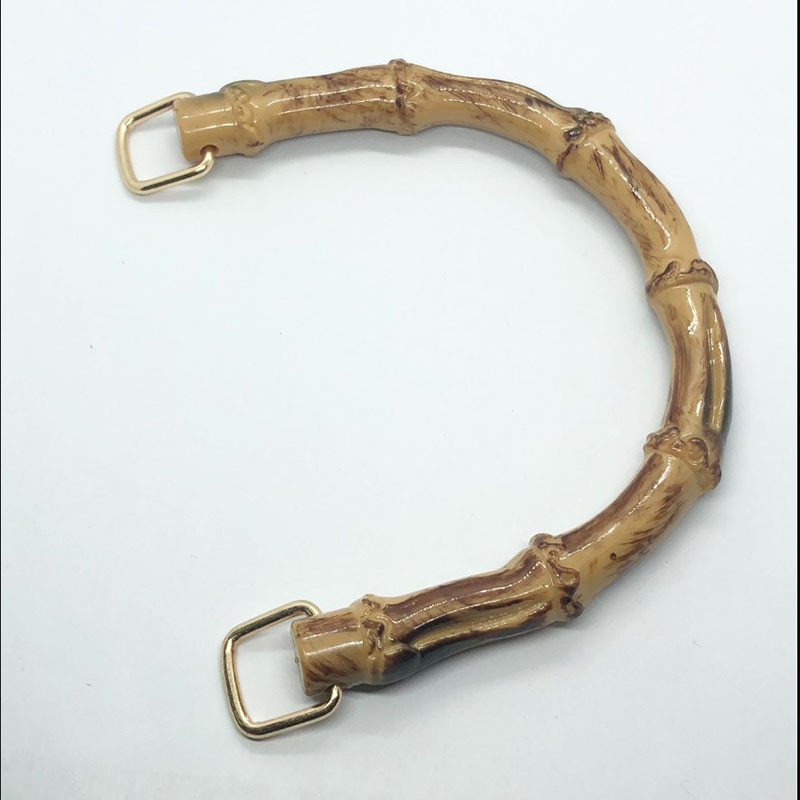 Nove ručke za torbe od imitacije bambusa u obliku slova D. Zamjenske ručke za ručne torbe. Pojasevi. Plastična torbica.