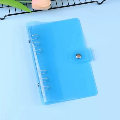 A7 izmēra caurspīdīgs, mīksts PVC 6 gredzenu iesiešanas piezīmjdatora vāks ar spiedpogas aizdari žurnālu plānotājam biroja kancelejas piederumiem