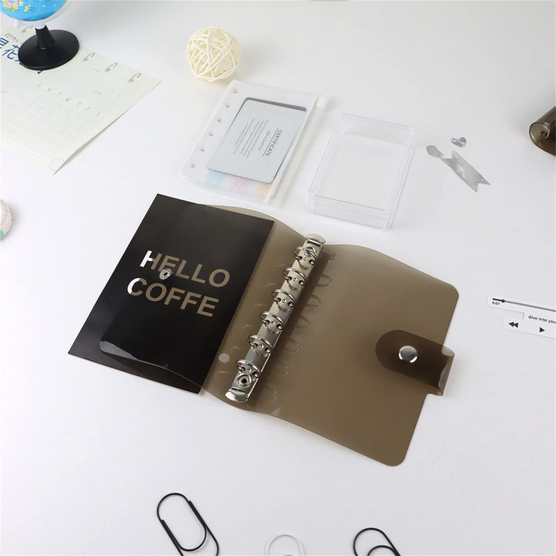 A7 izmēra caurspīdīgs, mīksts PVC 6 gredzenu iesiešanas piezīmjdatora vāks ar spiedpogas aizdari žurnālu plānotājam biroja kancelejas piederumiem