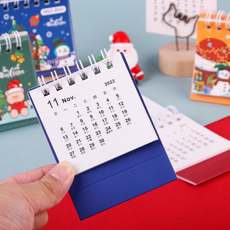 Patrauklus trikampis laikiklis dvigubos ritės dizainas, kompaktiškas, stovimas 2023 m. stalinis kalendorius, ornamentas stalinis kalendorius, įrašymo data