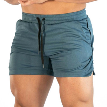 Най-новите мъжки едноцветни къси панталони със средна талия Фитнес тренировки за бягане Еластични шнурове Диви ежедневни летни спортни шорти