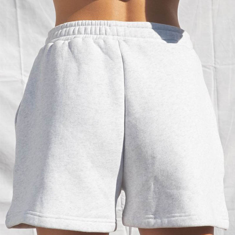 Naiste vabaaja spordipüksid Ühevärvilised elastse vöökohaga laia säärega lühikesed püksid, millel on kaldus taskud Naiste spordidressi treeningpüksid
