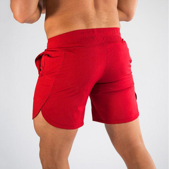 Мъжки къси панталони Muscleguys Секси плажни бермудски облекла Морски къси мъжки къси панталони за фитнес бързосъхнещи джоггери Спортни панталони Фитнес шорти