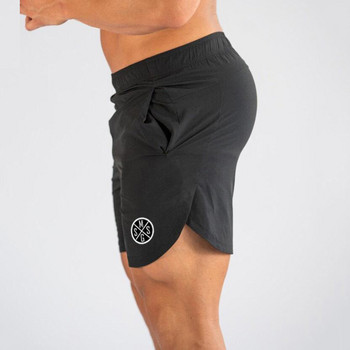 Мъжки къси панталони Muscleguys Секси плажни бермудски облекла Морски къси мъжки къси панталони за фитнес бързосъхнещи джоггери Спортни панталони Фитнес шорти