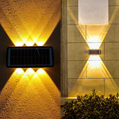 Saulės šviestuvai lauko aukštyn ir žemyn Šviečiantis apšvietimas Sieninė lempa Sodo apdaila Lauko saulės šviesa Saulės šviesa verandos tvoros šviestuvai