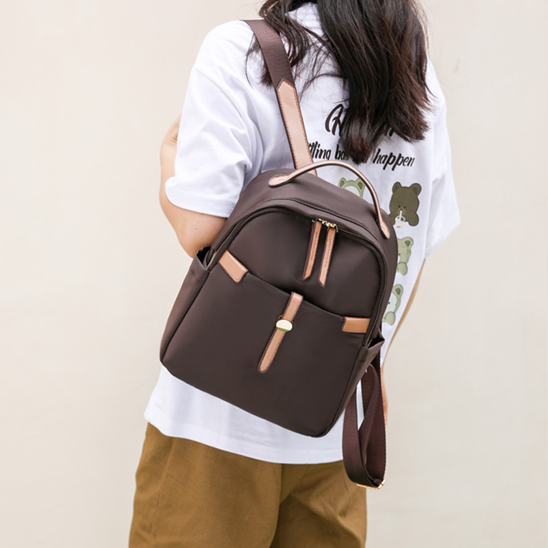 Vargusvastane ja vetthülgav nailonkangast seljakott Multifunktsionaalne suure mahutavusega koolikott Kuulus naiste disainiga seljakott