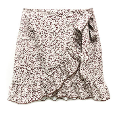 Vasaras sieviešu svārki ar augstu vidukli ar mežģīnēm ar loku, īsi svārki Eiropas un Amerikas modes svārki ar neregulāru apdruku ar rāvējslēdzēju