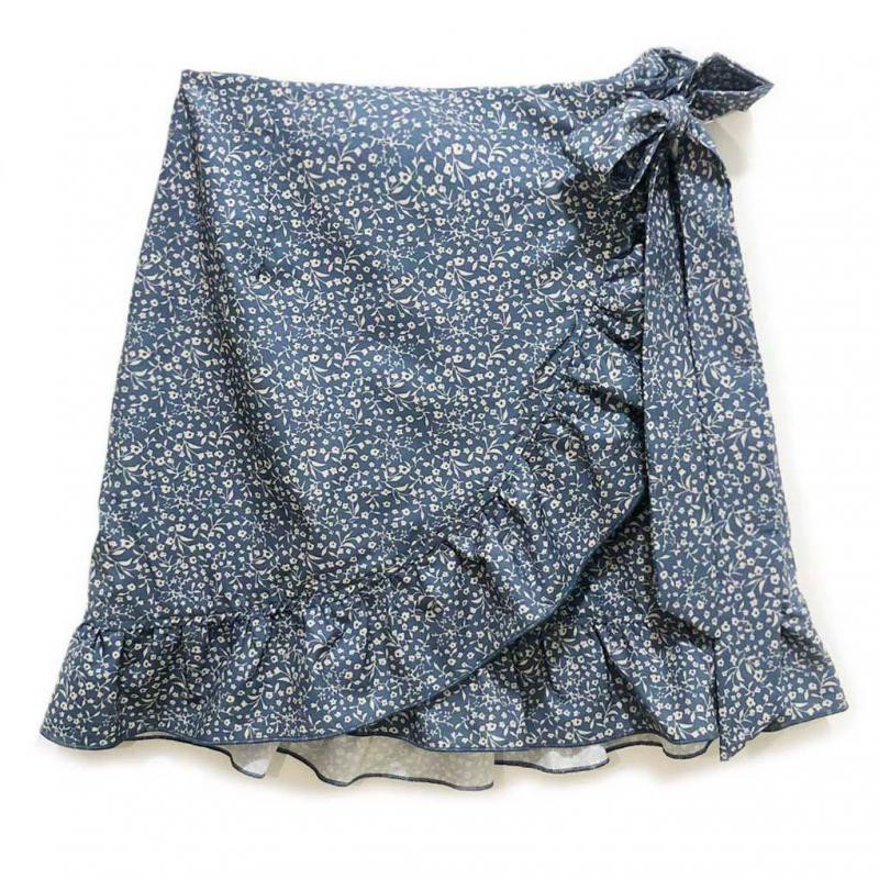 Vasaras sieviešu svārki ar augstu vidukli ar mežģīnēm ar loku, īsi svārki Eiropas un Amerikas modes svārki ar neregulāru apdruku ar rāvējslēdzēju