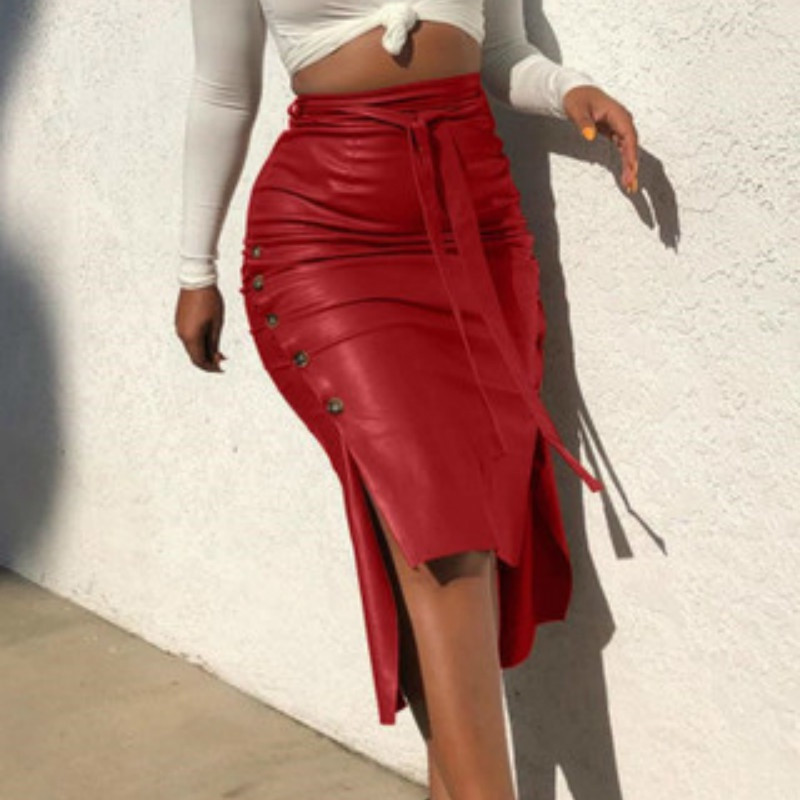 Sieviešu seksīgi pārsējs Pu ādas ballīšu svārki Modes masīvās ādas sānu pogas svārki gadījuma rakstura sadalīti midi svārki