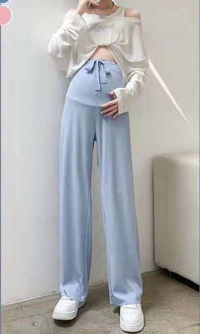 Pavasara jaunas, taisnas, modernas bikses, elpojošas plānas bikses grūtniecēm, valkājot brīvu ikdienas apģērbu