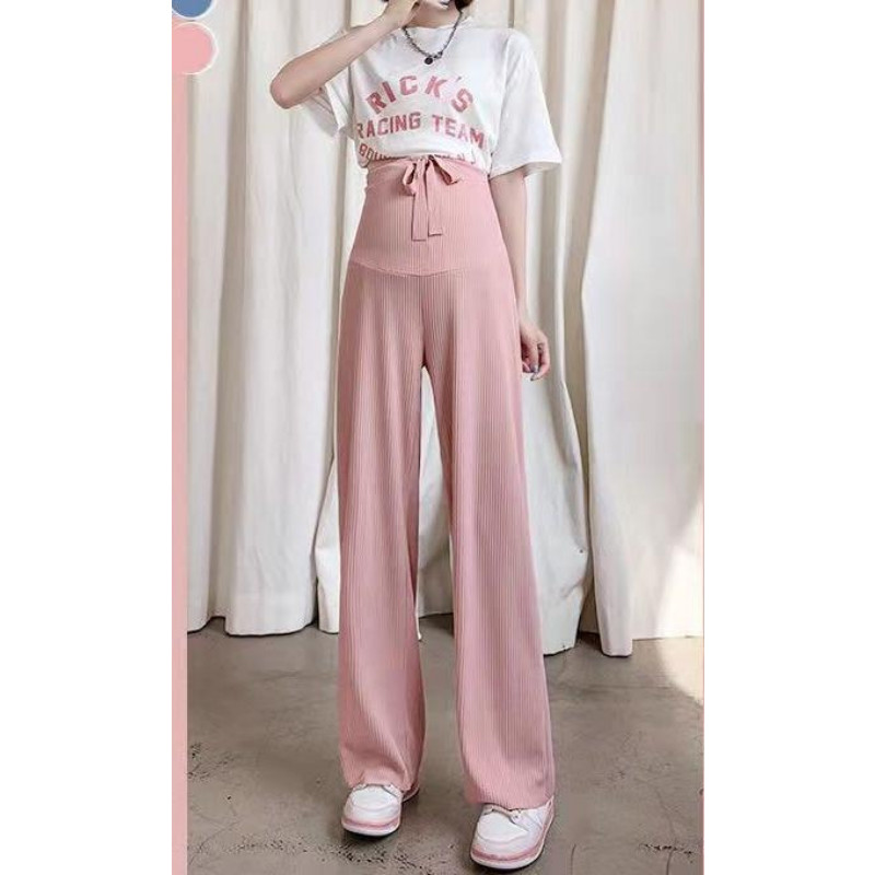 Pavasara jaunas, taisnas, modernas bikses, elpojošas plānas bikses grūtniecēm, valkājot brīvu ikdienas apģērbu