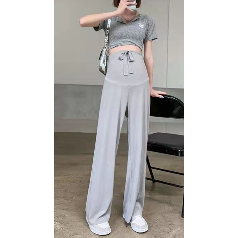 Pavasara jaunas, taisnas, modernas bikses, elpojošas plānas bikses grūtniecēm, valkājot brīvu ikdienas apģērbu