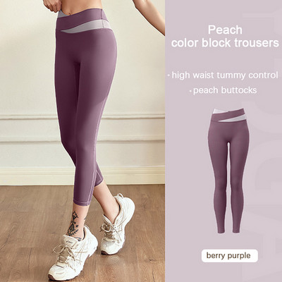 Aukšto juosmens klubus pakeliančios jogos kelnės Moteriškos kūno rengybos blauzdinės treniruotės Bėgimo pėdkelnės Greitai džiūstančios sportinės kelnės Elastinės pilvo kelnės